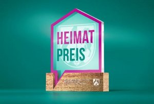 Imagebild mit pink-grüner Schrift Heimatpreis NRW