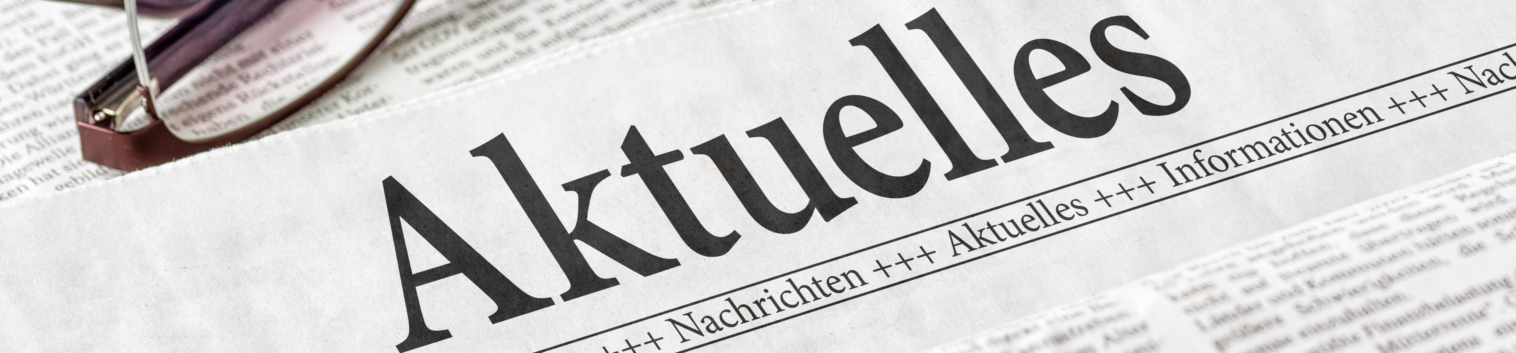 Zeitung mit der Überschrift Aktuelles